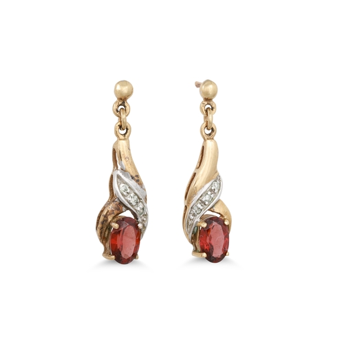 31 - A PAIR OF DIAMOND AND GARNET DROP EARRINGS, the oval garnet drops suspened from diamonds, mounted in... 