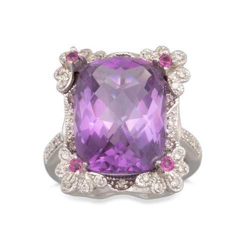 125 - AN AMETHYST AND DIAMOND CLUSTER RING, the mixed cut amethyst to diamond surround, mounted in 18ct wh... 