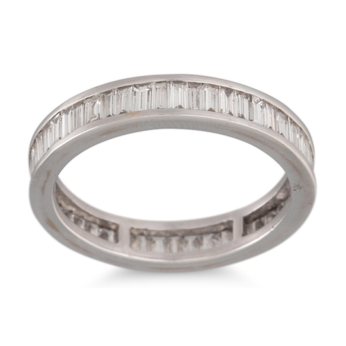 211 - A DIAMOND ETERNITY RING, the baguette cut stones, mounted in white gold. Estimated: weight of diamon... 