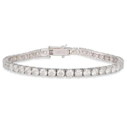 213 - A DIAMOND LINE BRACELET, the brilliant cut diamonds, mounted in 18ct white gold. Estimated: weight o... 