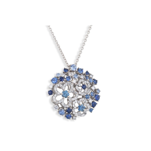 218 - A DIAMOND AND SAPPHIRE CLUSTER PENDANT, of circular openwork form, mounted in 18ct white gold, on a ... 