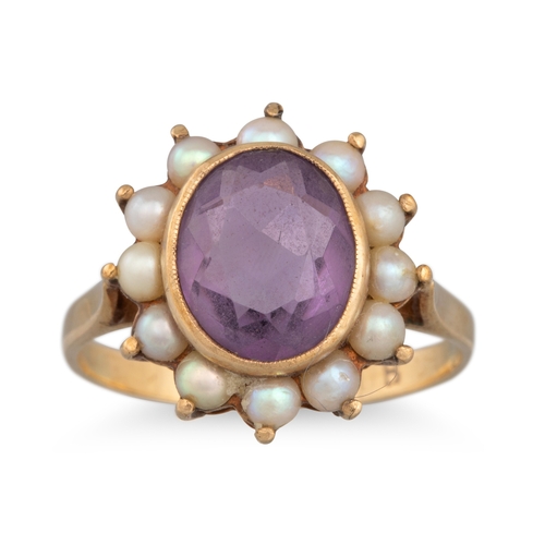 11 - AN AMETHYST AND SEED PEARL RING, mounted in 9ct gold, size M - N