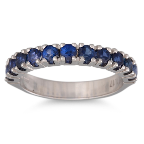 132 - A SAPPHIRE HALF ETERNITY RING, mounted in 18ct white gold. Estimated: weight of sapphires: 1.17 ct, ... 