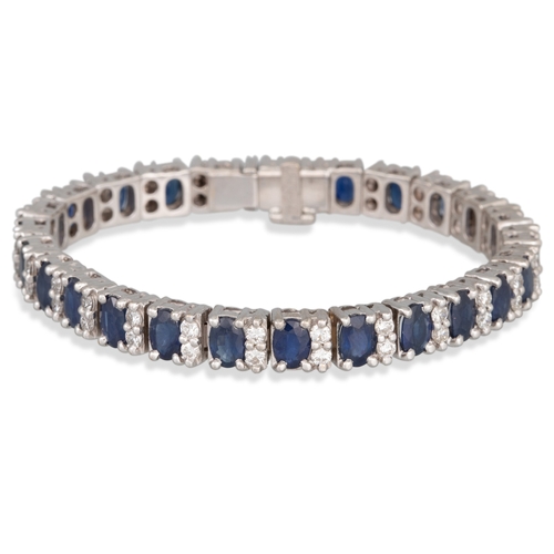 171 - A SAPPHIRE AND DIAMOND LINE BRACELET, the sapphires set between circular diamonds mounted in 18ct wh... 