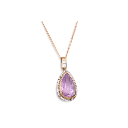 36 - A DIAMOND AND AMETHYST PENDANT, the oval amethyst to diamond surround, mounted in yellow gold, on a ... 