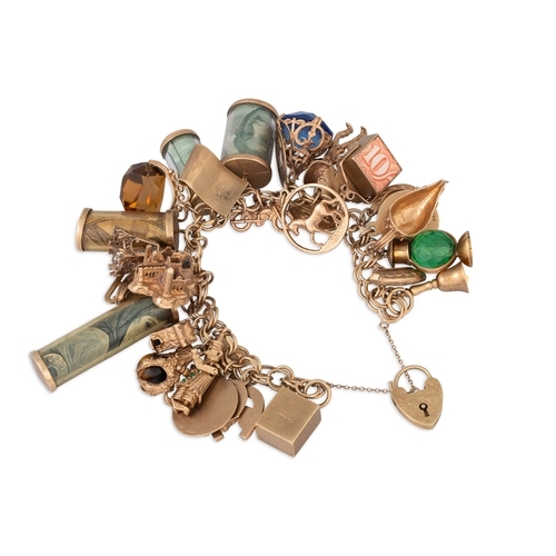 4 - A LARGE AND IMPRESSIVE 9CT GOLD CHARM BRACELET, with 33 charms attached, Irish assembled with Lady L... 