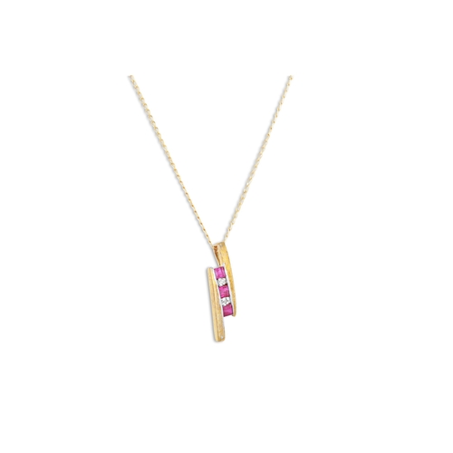 45 - A RUBY AND DIAMOND PENDANT, mounted in 9ct yellow gold, on a chain