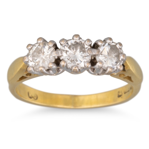 57 - A THREE STONE DIAMOND RING, mounted in 18ct yellow gold, size I. Estimated: weight of diamonds: 0.75... 