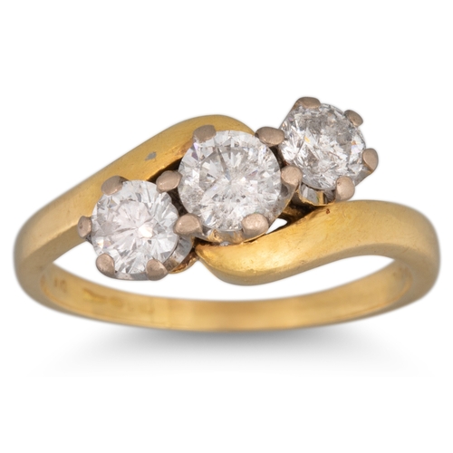 81 - A DIAMOND THREE STONE RING, the three diamonds in crossover setting, mounted in 18ct yellow gold, si... 