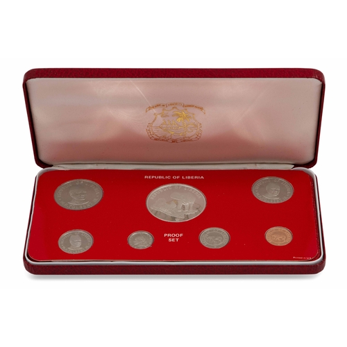 434 - A CASED 1983 UK PROOF COIN SET, a 1976 cased Republic of Liberia proof coin set, a cased 1976 Turks ... 