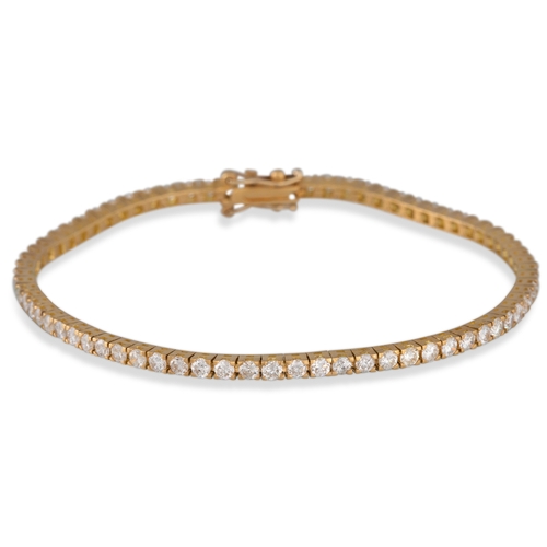 270 - A DIAMOND LINE BRACELET, set with brilliant cut diamonds, mounted in 18ct yellow gold. Estimated wei... 