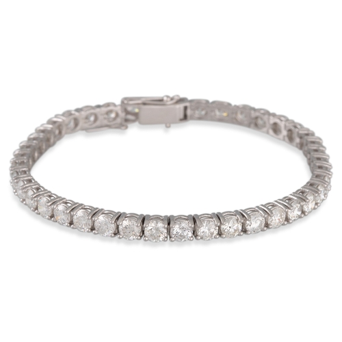 271 - A DIAMOND LINE BRACELET, the brilliant cut diamonds mounted in 18ct white gold. Estimated weight of ... 