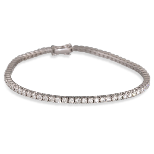 272 - A DIAMOND LINE BRACELET, the brilliant cut diamonds mounted in 18ct white gold. Estimated weight of ... 