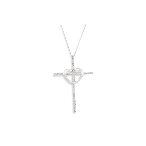 79 - A DIAMOND SET CROSS, in white gold, on a chain