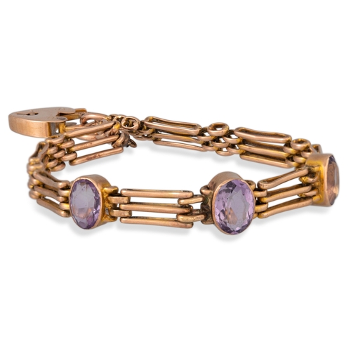 81 - AN ANTIQUE GOLD GATE BRACELET, set with three amethyst stones, padlock clasp