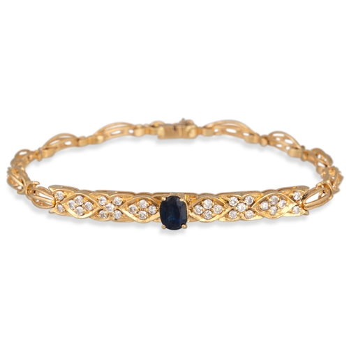 87 - A DIAMOND AND SAPPHIRE SET BRACELET, the central open set panel to chain link in yellow gold