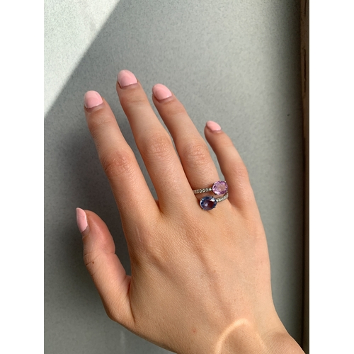 161 - A DIAMOND, BLUE & PINK SAPPHIRE RING, the blue and pink sapphires in cross over design to diamond sh... 