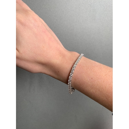 271 - A DIAMOND LINE BRACELET, the brilliant cut diamonds mounted in 18ct white gold. Estimated weight of ... 