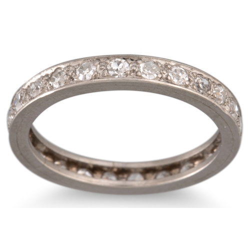 105 - A VINTAGE DIAMOND ETERNITY RING, the circular diamonds mounted in platinum. Estimated: weight of dia... 