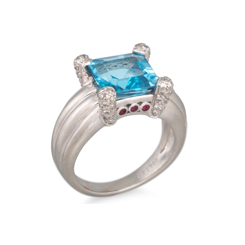 117 - A TOPAZ AND DIAMOND RING, mounted in platinum, size J