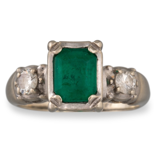 44 - A VINTAGE EMERALD AND DIAMOND RING, mounted in 14ct gold, size H