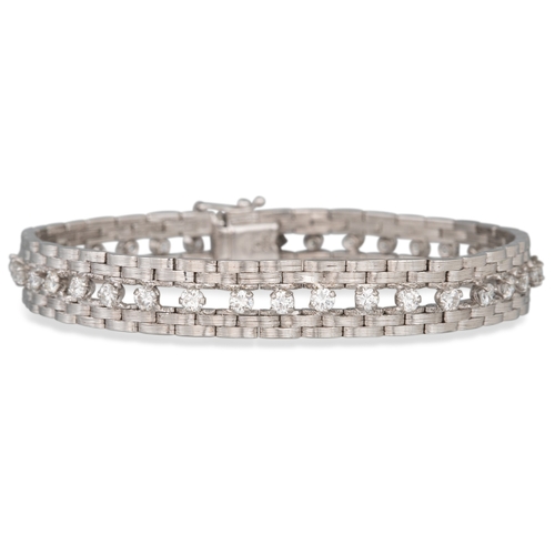 85 - A VINTAGE DIAMOND SET BRACELET, comprising a line of diamonds within a textured brick link border, i... 