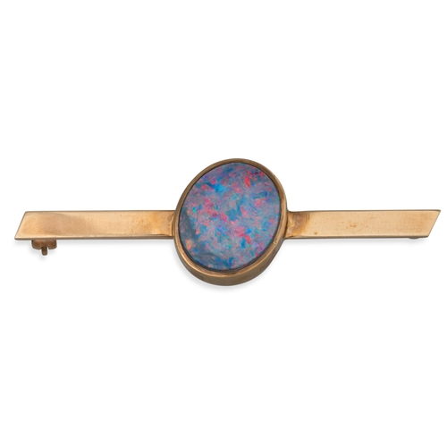 16 - A GOLD BROOCH, set with an opal doublet