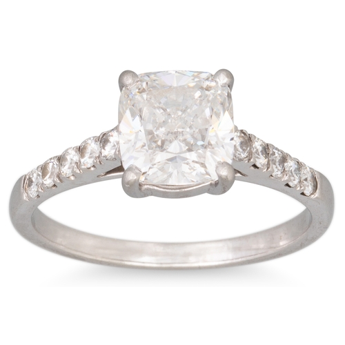 276 - A DIAMOND SOLITAIRE RING, the cushion cut diamond to diamond shoulders, mounted in platinum. Togethe... 