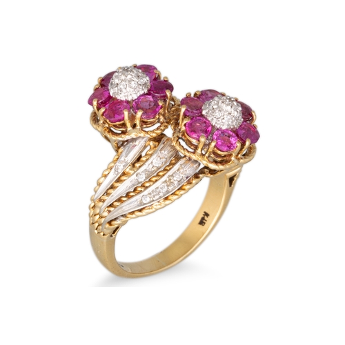 296 - A RUBY AND DIAMOND CLUSTER RING, of double floral cluster design, cross over form, mounted in 18ct g... 