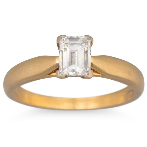 40 - AN EMERALD CUT DIAMOND SOLITAIRE RING, mounted in 18ct yellow gold. Estimated: weight of diamond: 0.... 