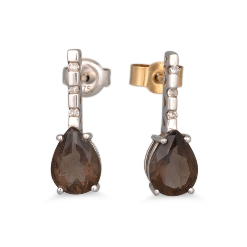 99 - A SUITE OF SMOKEY QUARTZ AND DIAMOND EARRINGS AND PENDANT, the pear shaped smoky quartz to diamond s... 