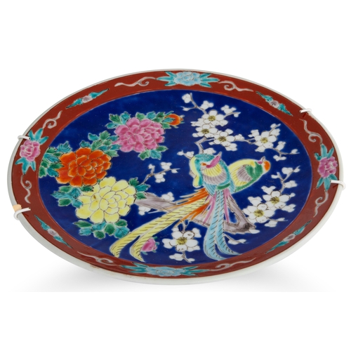 387 - A COLLECTION OF CERAMIC PLATES, two Japanese, one floral design and two French blue serving trays