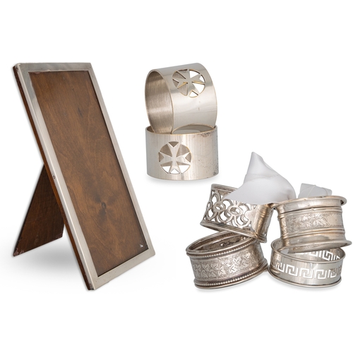 394 - SIX NAPKIN RINGS, 2 hallmarked silver, and a photo frame