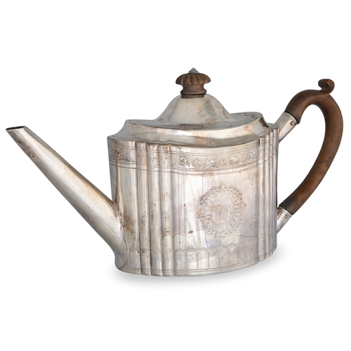 483 - A GEORGE III IRISH SILVER TEA POT, with wooden handle, by John Moore II, Dublin 1796, gw 566 g.