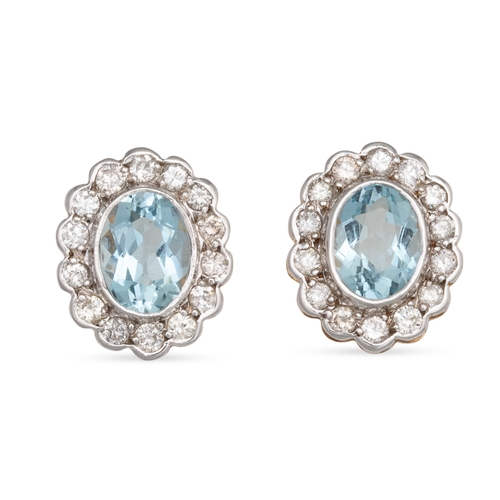 166 - A PAIR OF AQUAMARINE AND DIAMOND CLUSTER EARRINGS, mounted in white & yellow gold. Estimated: weight... 