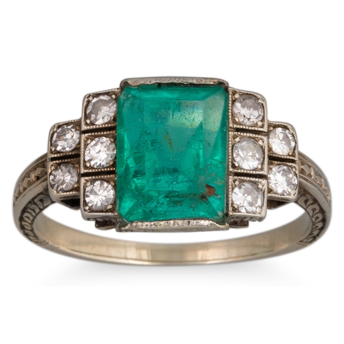 259 - A VINTAGE EMERALD AND DIAMOND SET RING, rectangular emerald to stepped diamond shoulders, in 18ct ye... 