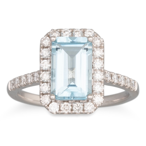 263 - AN AQUAMARINE AND DIAMOND CLUSTER RING, the rectangular aquamarine to diamond surround and shoulders... 