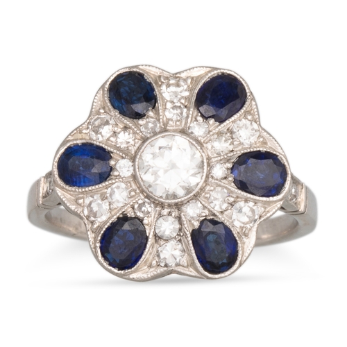 359 - A SAPPHIRE AND DIAMOND CLUSTER RING, of floral form, the central brilliant cut diamond to a sapphire... 