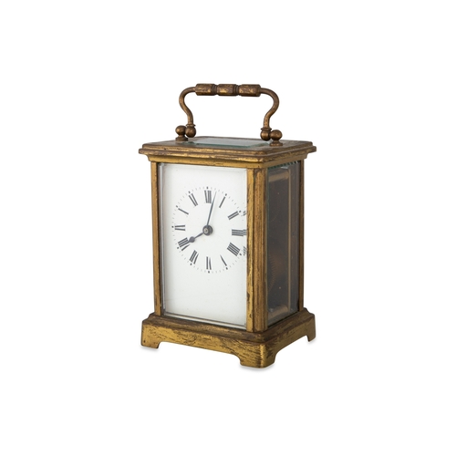 401 - AN ANTIQUE BRASS FRAMED CARRIAGE CLOCK, with glass sides, case & key