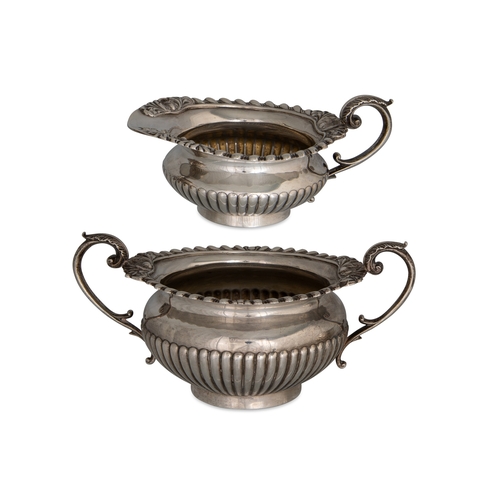 422 - A THREE PIECE VICTORIAN SILVER TEA SERVICE, with gadrooned decoration, by Goldsmith and Silversmith ... 