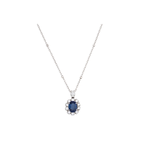 132 - A DIAMOND AND SAPPHIRE CLUSTER PENDANT, the oval sapphire to diamond surround, mounted in 14ct white... 