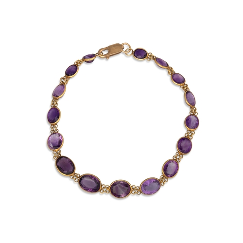 14 - AN AMETHYST SET BRACELET, the bezel set, graduated oval amethysts mounted in 9ct yellow gold