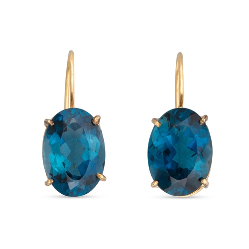 145 - A PAIR OF BLUE TOPAZ EARRINGS, mounted in yellow gold