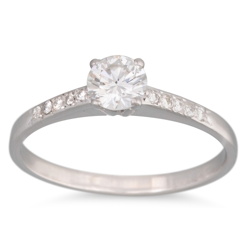 179 - A SOLITAIRE DIAMOND RING, the brilliant cut diamond to diamond shoulders, mounted in 18ct white gold... 