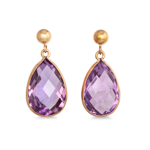 18 - A PAIR OF AMETHYST DROP EARRINGS, the pear cut amethyst mounted in 9ct yellow gold