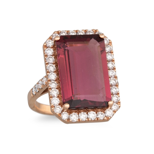 187 - A TOURMALINE AND DIAMOND CLUSTER RING, the rectangular tourmaline to brilliant cut diamond surround ... 