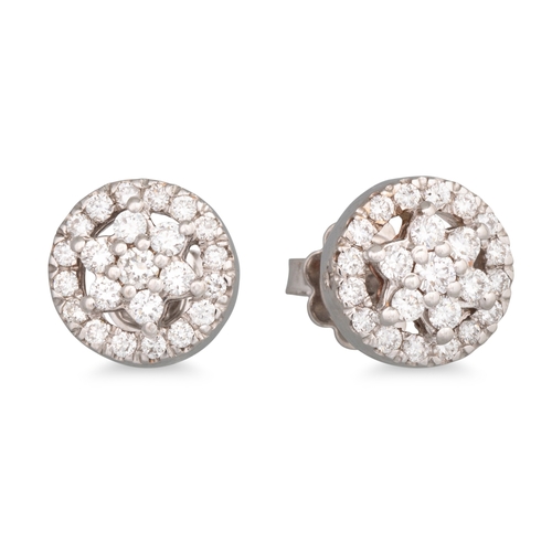 245 - A PAIR OF DIAMOND CLUSTER EARRINGS, mounted in 18ct white gold. Estimated: weight of diamonds: 0.69 ... 