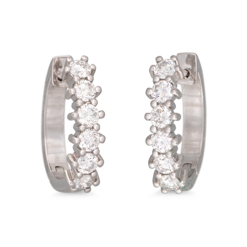 246 - A PAIR OF DIAMOND HALF HOOP EARRINGS, mounted in 18ct white gold. Estimated: weight of diamonds: 0.9... 