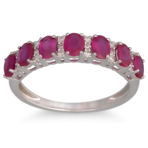 48 - A DIAMOND AND RUBY RING, the oval rubiesset alternate to brilliant cut diamonds, mounted in 18ct whi... 