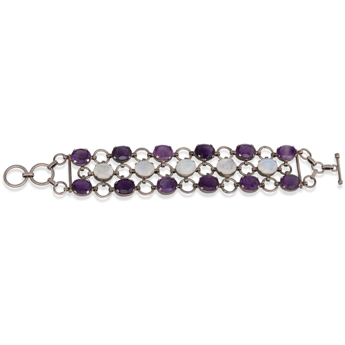 58 - AN AMETHYST AND MOONSTONE BRACELET, the oval stones mounted in silver